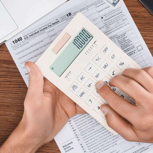 A person using a calculator to calculate their R&D Tax Credit